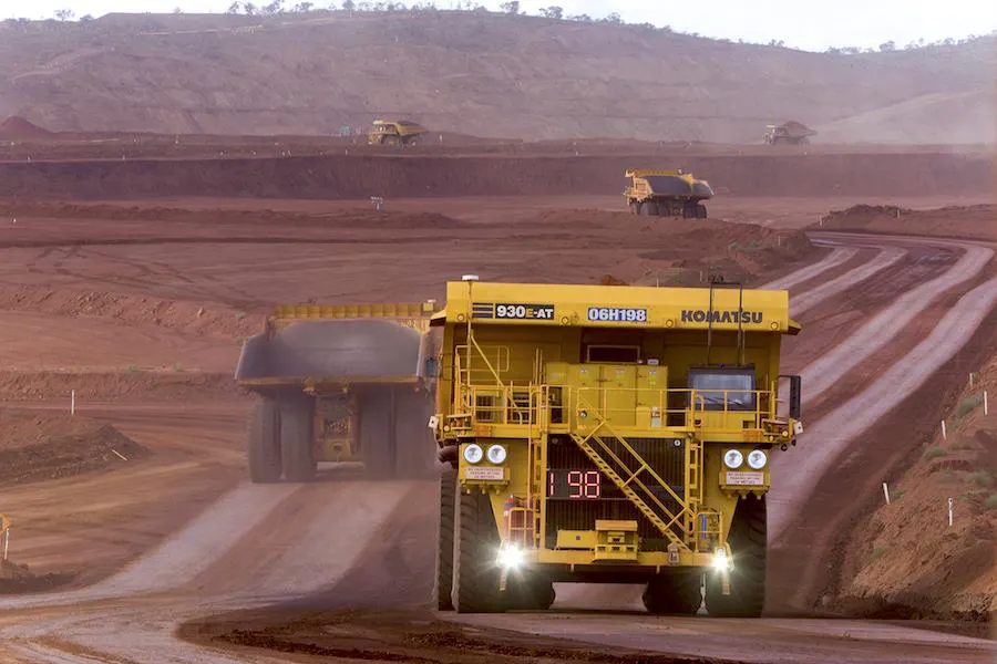 Komatsu haul truck driving up a ramp in an open-pit mine